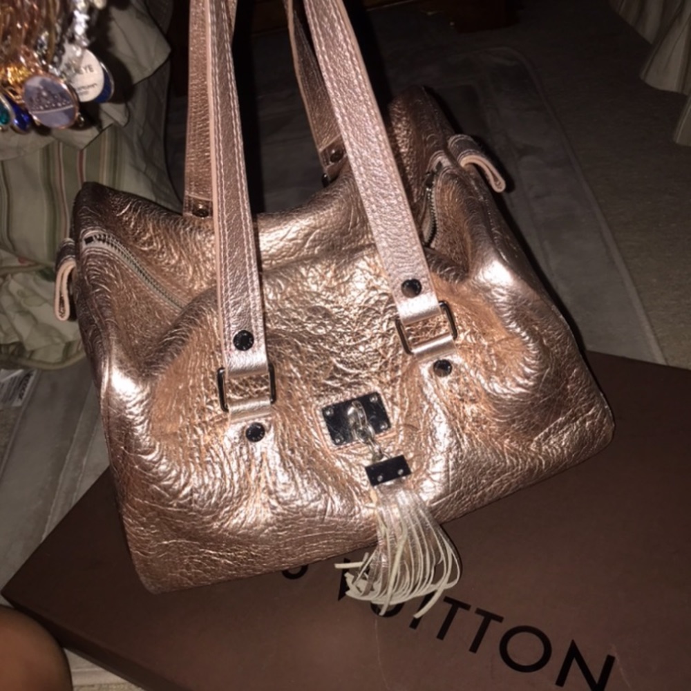 Louis Vuitton pink shimmer “empreinte comete”bag